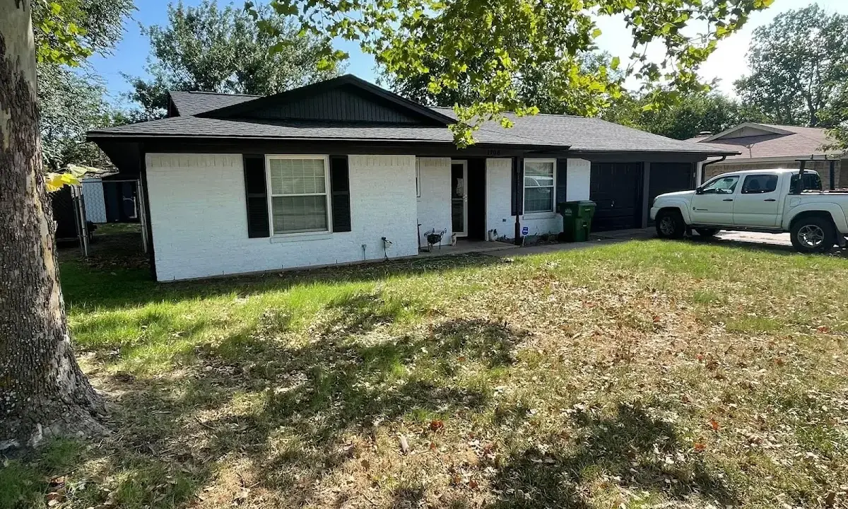Professional roofing crew working on a residential roof in Highland Springs